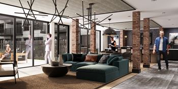 A modern living room with a man walking in.